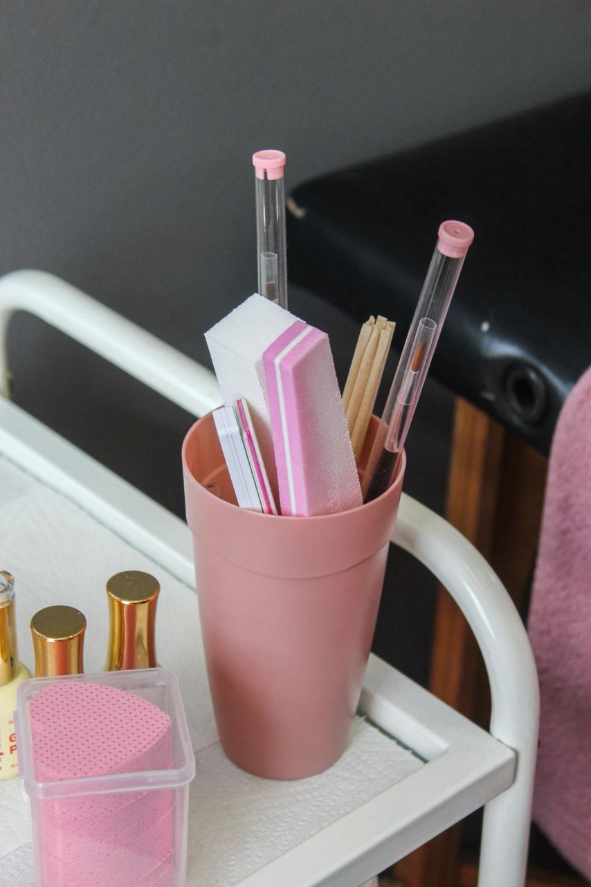 Nail art tools and buffers on a beauty trolley in the salon