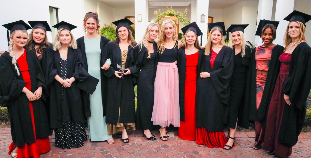 Graduating class in caps and gowns at Helderberg School of Beauty 2025