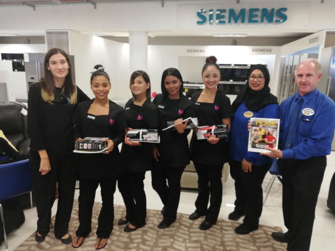 Group of beauty students and instructor in a showroom