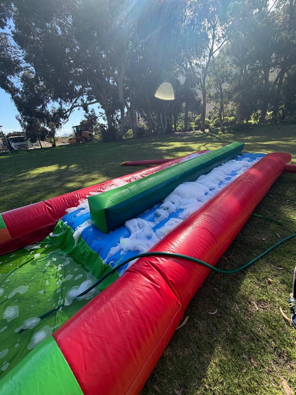 Inflatable slip and slide set up outdoors for team building fun