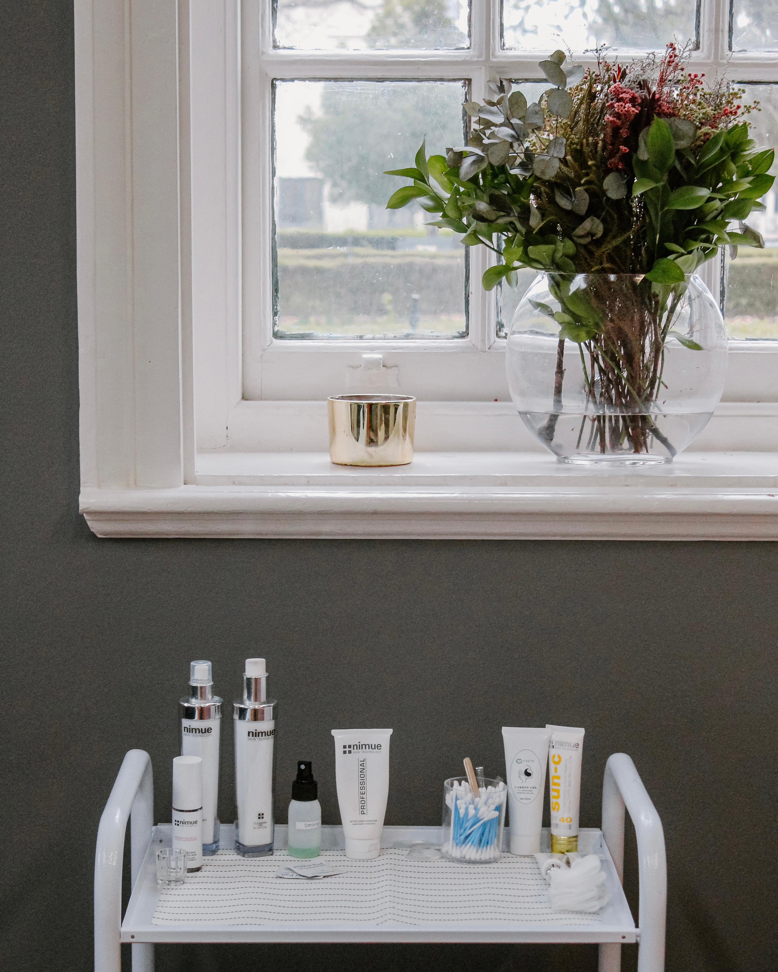 Nimue skincare products displayed on a trolley by the window